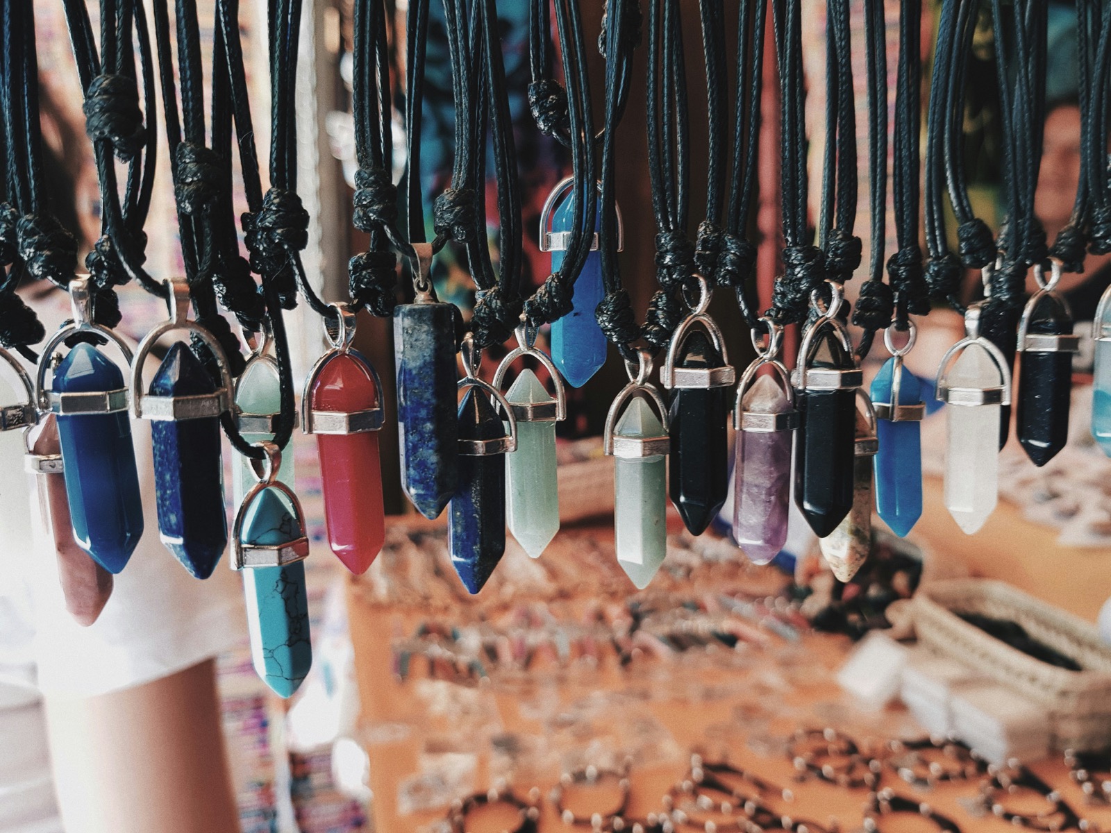 Colorful gemstone pendants representing the diverse values that shape philanthropic giving