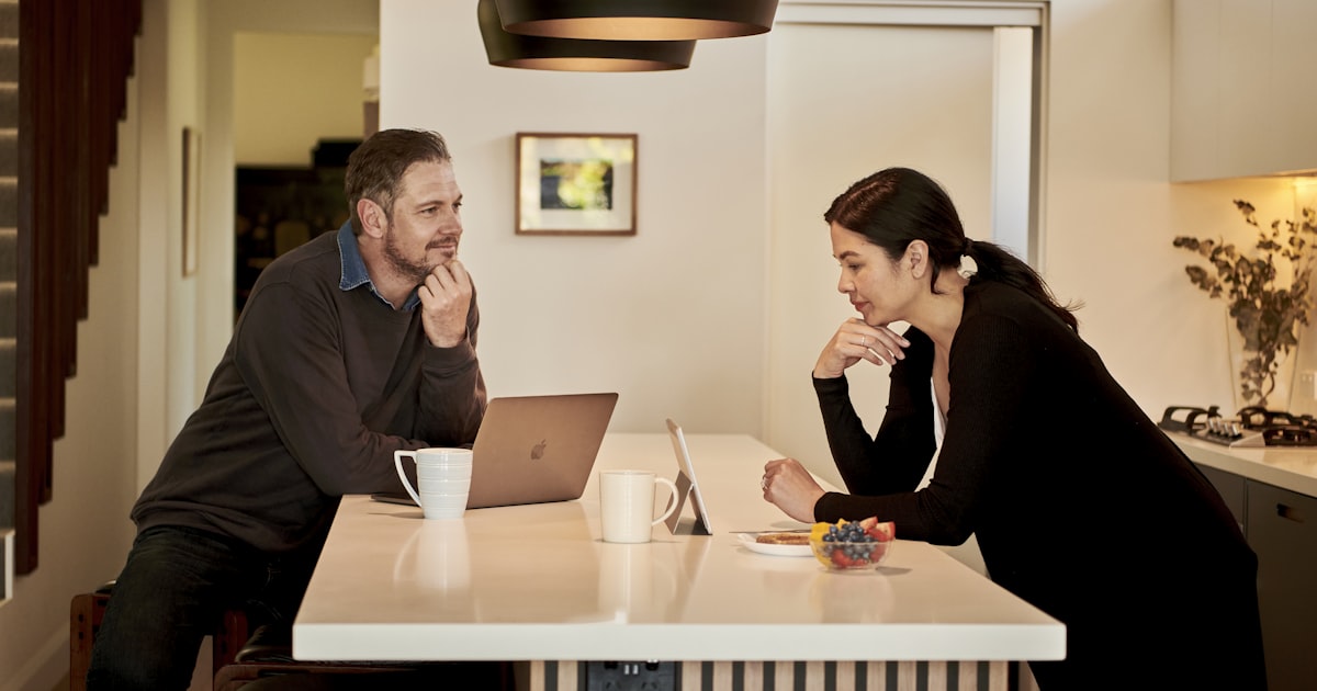 A couple talking together at their kitchen table — deciding who should be in the room for the giving conversation